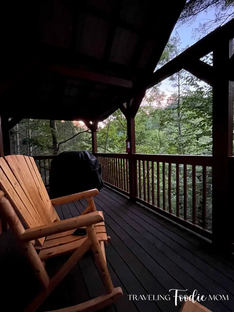 cabin in the woods at sunset rocking chair